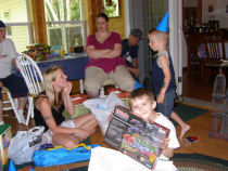 Drew holding up a present